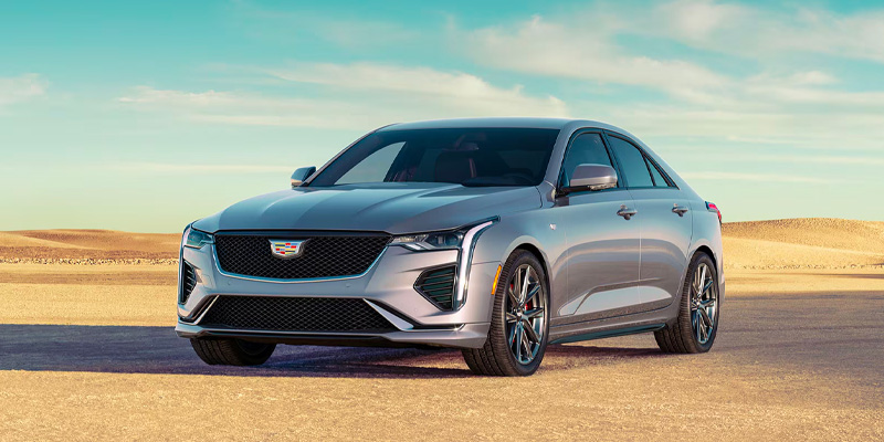 a silver 2026 Cadillac CT4 sedan is parked in a desert